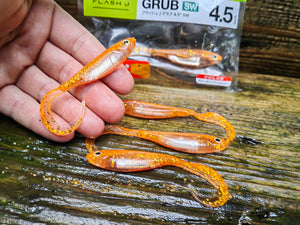 Fish Arrow Flash-J Grub 4.5″ SW — 121 Glow Orange/Silver, 5 szt.